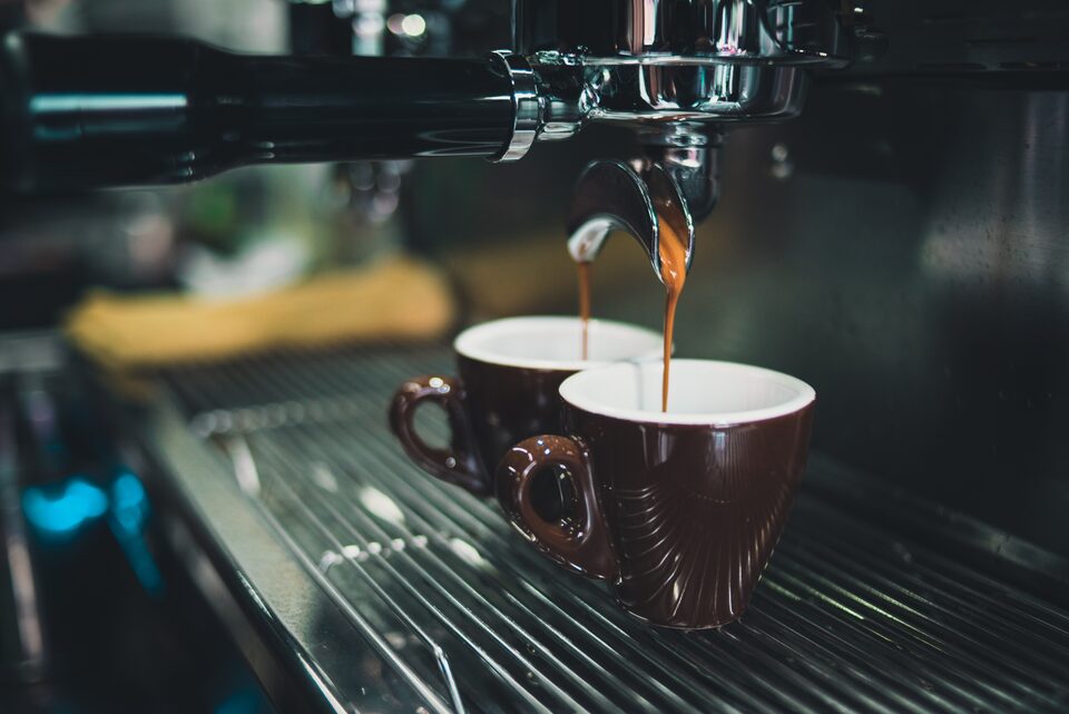 An espresso machine pulling two cups