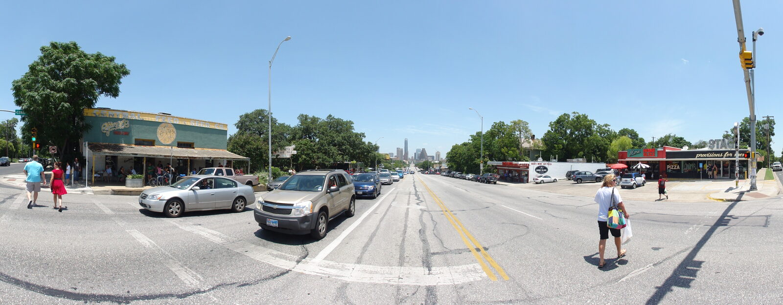 The South Congress strip in Austin on a bright day, lined with shops and cafes